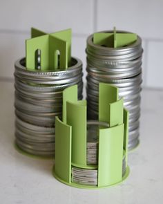 several stacks of silver and green magnets stacked on top of each other