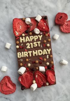 a birthday cake with marshmallows and chocolate frosting that says happy 21st birthday