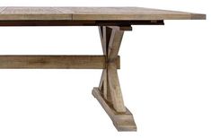 a wooden table sitting on top of a white floor