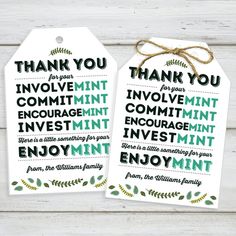 two tags that say thank you and have the words in green, white and black on them