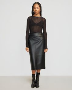 Our latest take on the vegan leather skirt — Briony features a sleek silhouette with a back split for easy movement. We love to style this midi with a cozy sweater for an effortless day-to-night look. See below for our general Size Guide and available measurements Self made of 100% polyurethane, lining made of 100% polyester Machine wash cold and lay flat to dry Vegan Leather Skirt, Black Leather Skirts, Cozy Sweater, Night Looks, Split Hem, Cozy Sweaters, Lay Flat, Leather Skirt, Vegan Leather