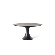 an oval table with black legs on a white background