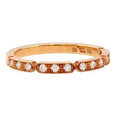 an orange and white diamond band ring