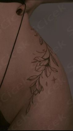 the back of a woman's stomach with leaves on it