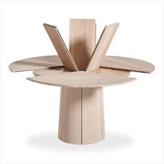 the circular table is made from wood and has four sections on each side, with one section