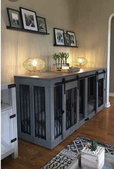 a living room filled with furniture and pictures on the wall above it's doors