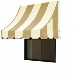 a white and black striped awning on top of a window sill next to a door