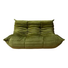 a green couch that is sitting on top of a white background with the back end down