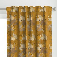 a yellow curtain with birds on it