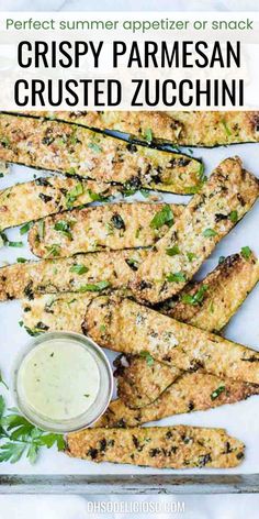 crispy parmesan crusted zucchini on a plate with dipping sauce