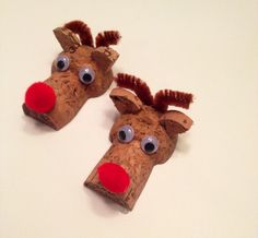 two paper mache reindeers with googly eyes