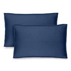 two dark blue pillows on a white background