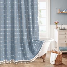 a bath room with a tub and a shower curtain