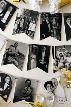 black and white photo hanging on the wall next to some gold ribbon with confetti