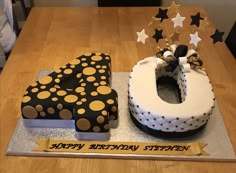 a birthday cake that is shaped to look like the letter g and has polka dots on it