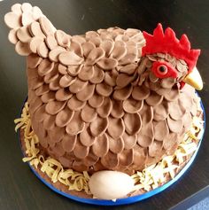 a cake shaped like a chicken on top of a table