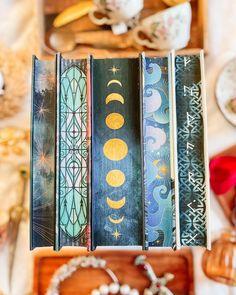 an assortment of books sitting on top of a table