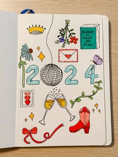 an open notebook with drawings on the cover and numbers, symbols, and other items