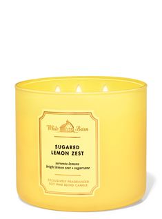 a lemon zest candle in a yellow glass container on a white background with the words,