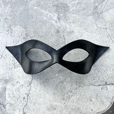 "This little leather half mask is so versatile, it can work for a wide range of costumes  from bandit to Zorro, to superhero, or supervillain! MEASUREMENTS + MATERIALS ✭ Materal: tooling leather, dye, paint, sealant, and quality ribbon ties. ✭ Measures approximately 8.5\" wide x 3\" high at the highest and widest points ✭ Ties with gorgeous and durable stretch lace ribbon straps (included). This well made domino/half mask was cut and shaped from premium tooling leather. It has been dyed and pain Half Mask Design, Domino Mask, Superhero Mask, Skeleton Mask, Paint Sealant, Superhero Masks, Superhero Cosplay, Half Mask, Leather Dye