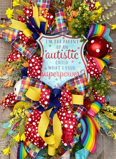 "This Autism Awareness Wreath will look amazing hanging on your front door.  This design will be a perfect gift for someone or even a special treat to yourself!    Important facts about this piece: Dimensions: 34x24x9 Care Instructions: We recommend hanging our creations on a door that has an overhang to protect it even though most of our materials in our creations are considered durable to outdoor exposure. When storing your creations between season they should be in a climate controlled environment. Extreme heat or cold can cause things to happen to your beauties. If this one of a kind Autism Awareness wreath isn't the perfect fit, check out the other related products in our shop! I welcome you to \"Favorite My Shop\" and share with friends and family." Awareness Wreath, Wreath Summer, Wreath Making, Ribbon Wreath, Crafts To Make And Sell, Extreme Heat, Everyday Wreath, Important Facts, Door Wreath Hanger