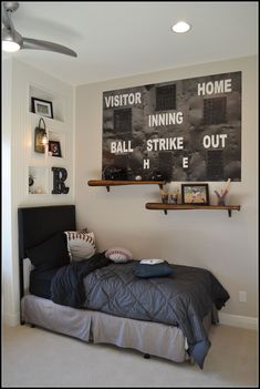 a baseball themed bedroom is shown in black and white, with shelves above the bed