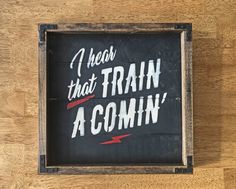 a wooden sign that says i teach that train as comin'on the wall