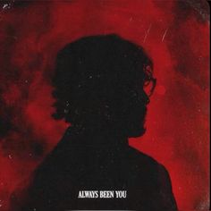 the silhouette of a man with glasses against a red background that says always been you