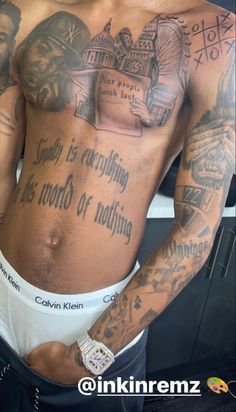 a man with many tattoos on his chest