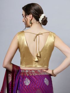 Item Type: Saree blouse / Crop top Product Features: Color: Gold Fabric: Cotton Satin Stretch Blend Trim: Back Tie Neck Style: V-Neck, Front & Back Sleeve Length: Sleeveless Closure: Back Hook Padded: No Disclaimer: There will be slight difference in digital to actual image Sleeveless Blouse For Saree, Blouse For Saree, V Neck Sleeveless Blouse, Blouse Crop Top, Blouse Crop, Gold Satin, Gold Fabric, Innovative Fashion, Traditional Sarees