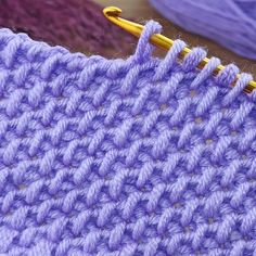 the crochet stitch is being worked on