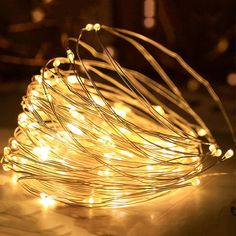 a string of white lights sitting on top of a table