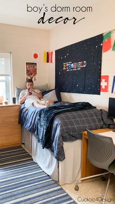 a boy is sitting on his bed reading a book