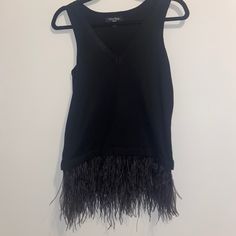 Nwot Lea & Viola Lounge Feather Tank. Sweater Material, V-Neck, Feather Detailing, Never Worn. Super Cute And Fashionable. Perfect For A Night Out! Size Xs. Smoke Free Home. Fringe V-neck Top For Fall, Chic Sleeveless Feathered Top, Spring Evening Tops With Feather Trim, Spring Sleeveless Tops With Feather Trim, Sleeveless Tops With Feather Trim For Spring, Sleeveless Feather Trim Tops For Spring, Feather Trim Tops For Fall Party, Fall Party Tops With Feather Trim, Chic Feathered Tops For Fall