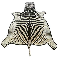 a black and white zebra skin pattern on the back of a large animal hide rug