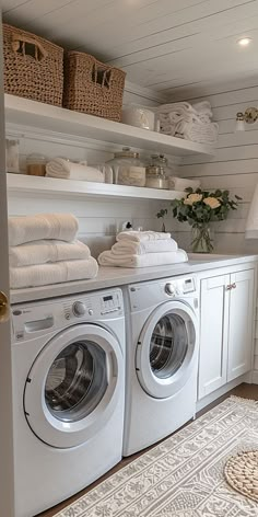 a washer and dryer in a white laundry room