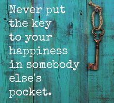 a key hanging from the side of a wooden door with a quote on it that says, never put the key to your happiness in somebody else's pocket