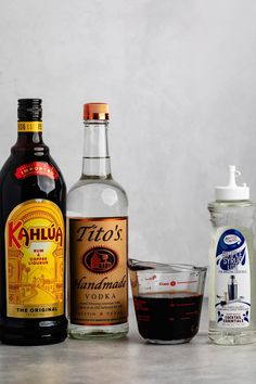 the ingredients to make an alcoholic cocktail are shown