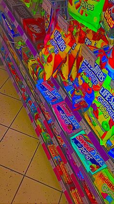 a display in a grocery store filled with lots of colorful candy bar wrappers on top of each shelf