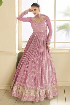 Step into the spotlight with our stunning Anarkali suit crafted from premium viscose fabric, meticulously designed to make you the star of any function. The luxurious drape of viscose, combined with intricate embroidery, creates a harmonious blend of tradition and contemporary elegance. Wedding Anarkali Dress, Eugeniya Belousova, Elegant Anarkali, Jacquard Gown, Gown With Dupatta, Designer Anarkali Suits, Carnation Pink, Bridesmaid Saree, Party Wear Gown