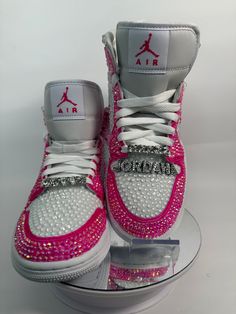 Step up your sneaker game with some fully blinged Jordan 1 mids. These shoes are a great addition for prom, a birthday, a wedding, a night on the town, or your  next event! These shoes can be customized to the colors of your choosing. Not looking for Jordan 1's? Message me with your shoe choice. I'd love to create the custom shoe of your dreams. Please note, shoe charms are not included in the listing but are available as a bonus add on. Please see my listing entitled EXTRAS to add shoe charms.  *Disclaimer We are not associated with the brand, I only hand customize the shoes using rhinestones. Nike Rosa, Rhinestone Sneakers, Jordan 1 Mids, Casual Shoes Women Sneakers, Bedazzled Shoes, Nike Shoes Women Fashion, Pretty Sneakers, Pink Nike Shoes, Custom Rhinestone