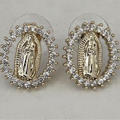 Add A Touch Of Spirituality To Your Everyday Look W/ These Minimalist, Dainty Gold Colored Stud Earrings Ft. A Beautiful Pendant Of The Virgin Mary Surrounded By A Delicate Rhinestone Oval Border, This Piece Is A Symbol Of Love, Faith, & Healing. The Virgin Mary Is Revered For Her Compassionate Heart & Intercessory Role, Making These Earrings A Thoughtful Gift To You Or For Those Seeking Protection & Guidance. Perfect For Everyday Wear, These Understated Yet Meaningful Earrings Will Remind You O Faith Healing, The Virgin Mary, Gold Rhinestone, Minimalist Aesthetic, Love Symbols, Virgin Mary, Princess Polly, Everyday Look, Thoughtful Gifts