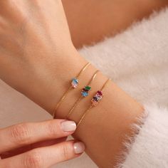 Elevate your style and celebrate life's special moments with our stunning Baguette Birthstone Bracelet. Crafted with exquisite baguette-cut birthstones, this bracelet is a beautiful expression of personal style and sentimentality. Each birthstone represents a special month, making this bracelet a perfect birthday gift or meaningful token for Mothers Day. Whether you choose to honor your own birth month or those of your loved ones, this personalized bracelet is sure to become a cherished keepsake Affordable Adjustable Birthstone Charm Bracelet, Crystal Bracelet With Stones As A Gift, Cubic Zirconia Jubilee Bracelet As Gift, Gift Crystal Bracelet With Adjustable Chain And Cubic Zirconia, Gift Cubic Zirconia Crystal Bracelet With Adjustable Chain, Adjustable Oval Bracelets As Gift, Adjustable Oval Bracelet For Gift, Cubic Zirconia Bracelets With Stones As Gift, Dainty Oval Bracelets As Gift