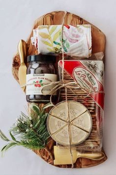 an assortment of cheeses and condiments in a basket