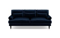 a blue couch with pillows on it