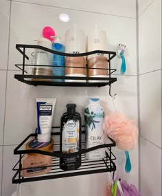 two black shelves filled with different types of personal care products and toiletries in a bathroom