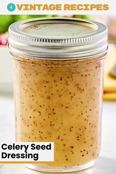 a close up of a jar of food on a table with the words celery seed dressing