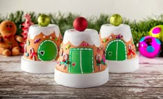 three gingerbread houses decorated to look like they're ready for the holiday season