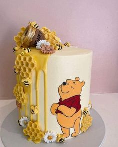 a winnie the pooh cake with honey dripping from it