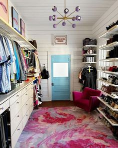 the closet is full of shoes and other items, including clothes hanging on shelving units